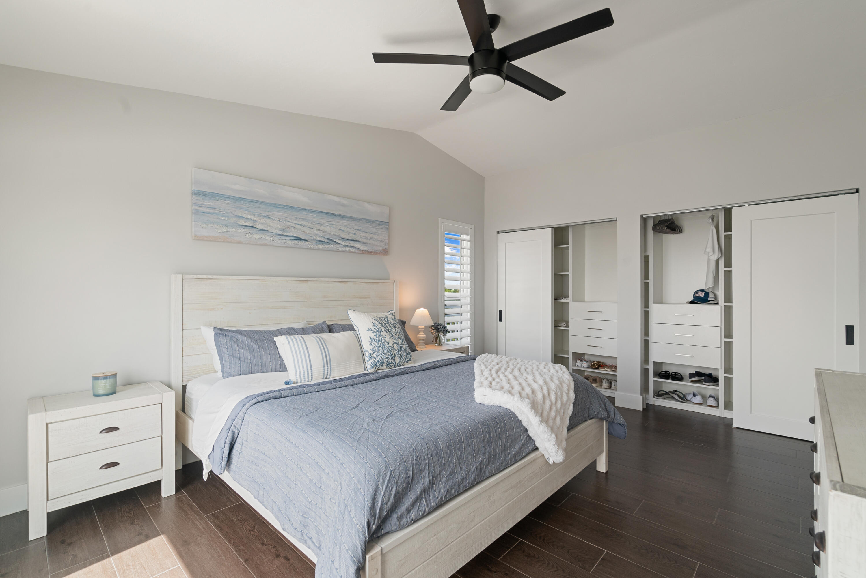 215 Wildwood Circle Key Largo, FL 33037 - Photo 22 of 61 a bedroom with a large bed and a chandelier