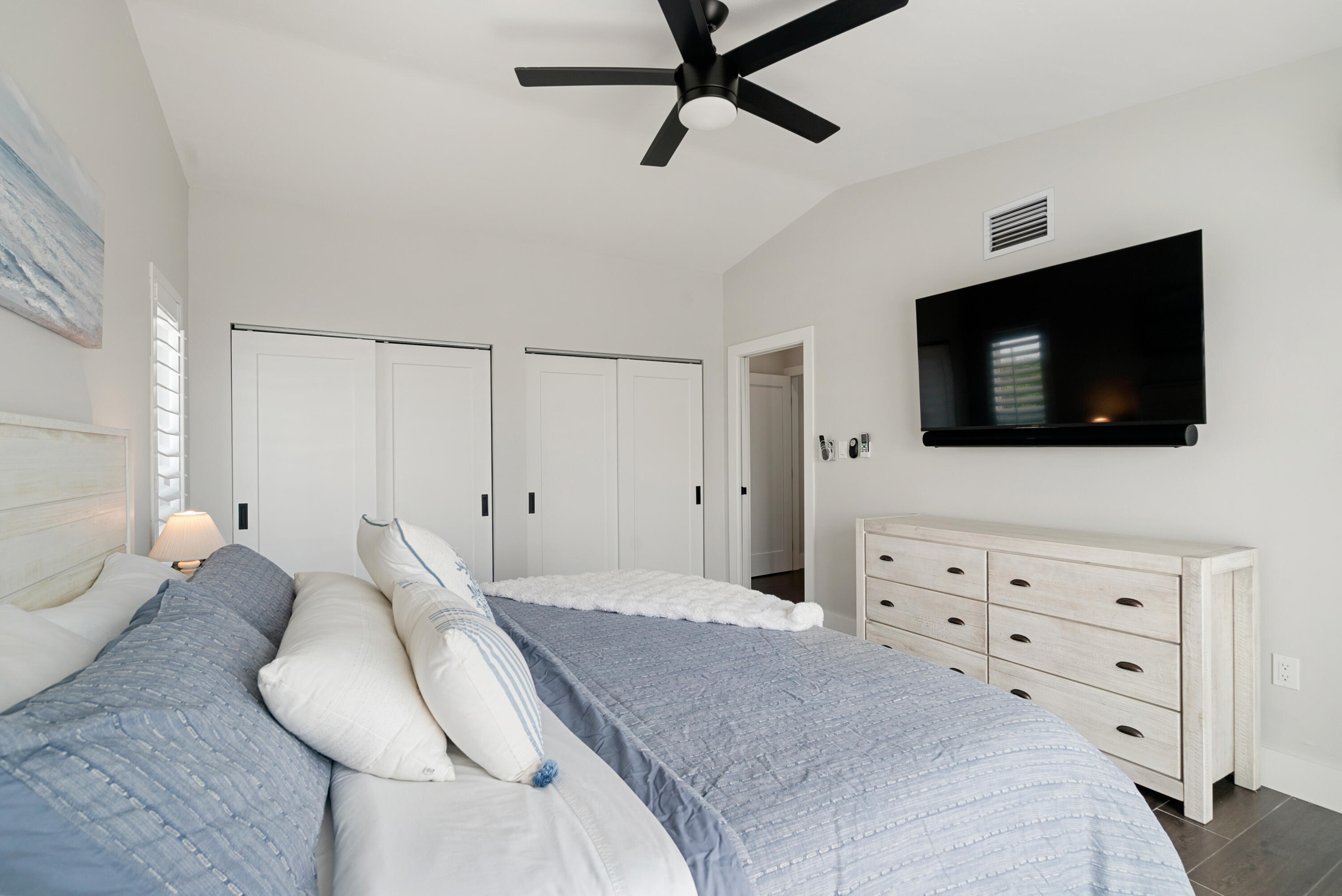 215 Wildwood Circle Key Largo, FL 33037 - Photo 24 of 61 a bedroom with a bed and a flat screen tv