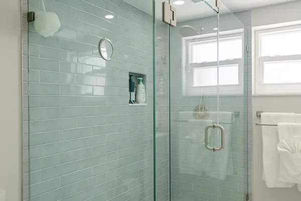 a bathroom with a shower and a sink