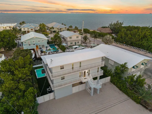 an aerial view of a house with mountain view