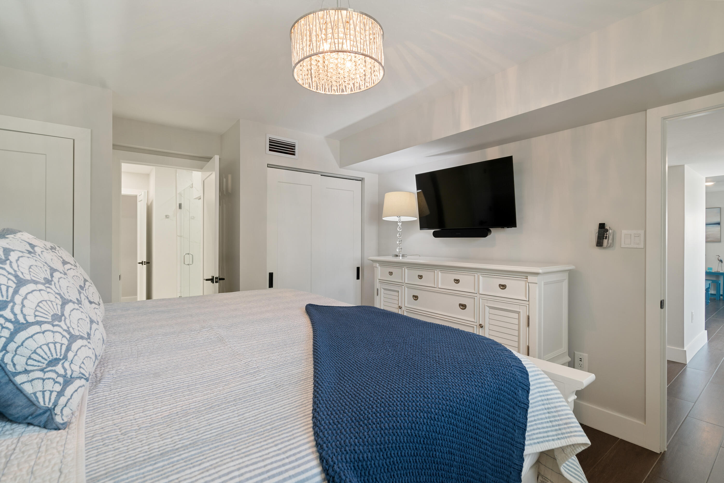 215 Wildwood Circle Key Largo, FL 33037 - Photo 34 of 61 a spacious bedroom with a bed and a flat screen tv