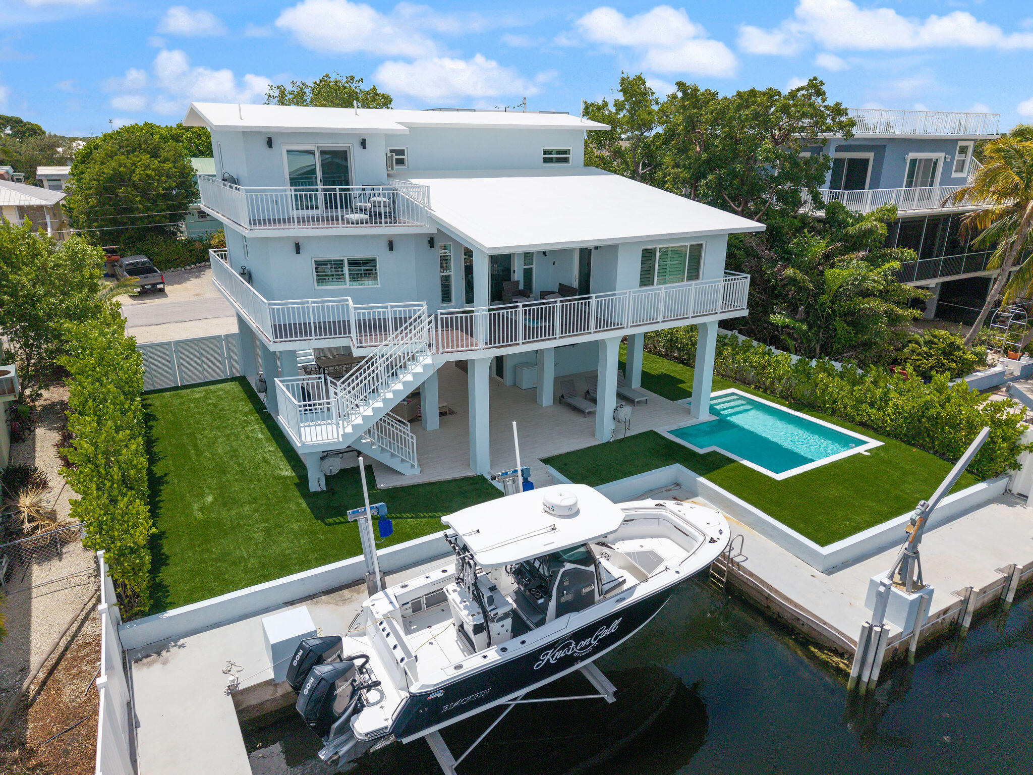 215 Wildwood Circle Key Largo, FL 33037 - Photo 4 of 61 an aerial view of a house with a big yard