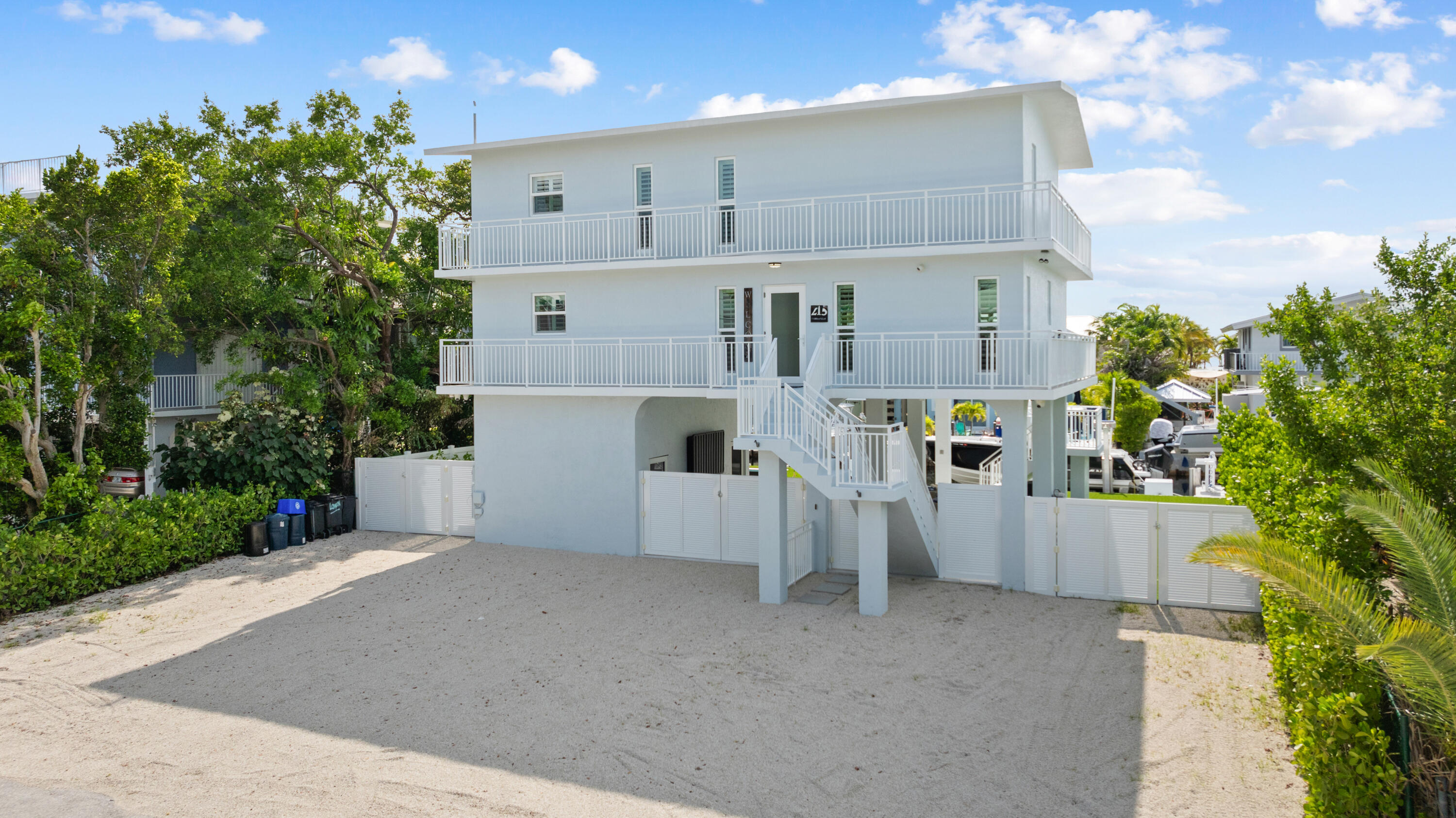 215 Wildwood Circle Key Largo, FL 33037 - Photo 49 of 61 a view of a house with a backyard