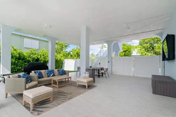 a living room with furniture and a garden