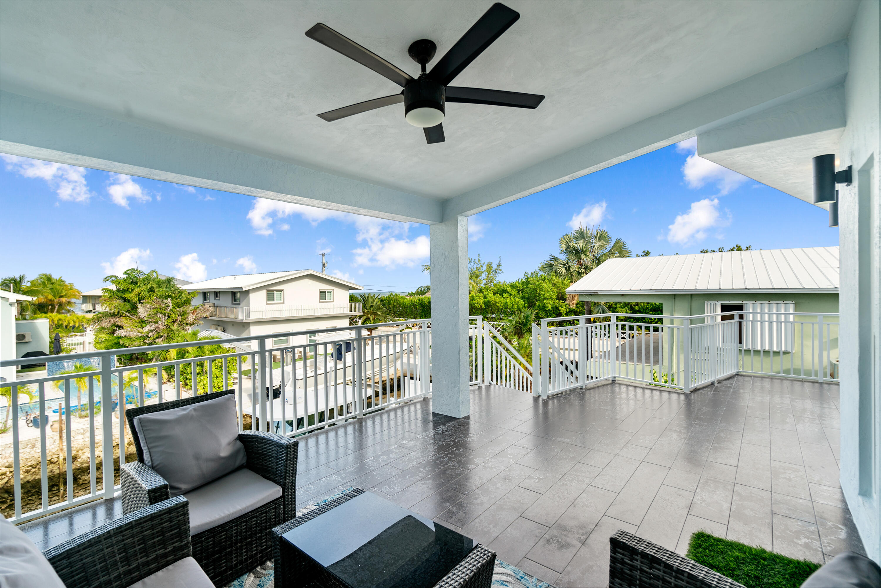 215 Wildwood Circle Key Largo, FL 33037 - Photo 10 of 61 a view of a patio with a table and chairs