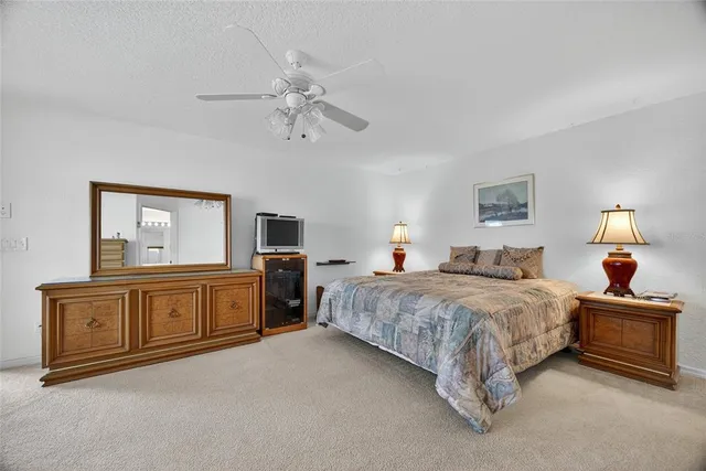 a bedroom with a large bed and a couch