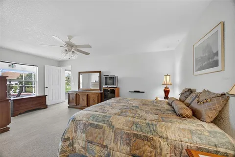 a spacious bathroom with a mirror a sink and glass door