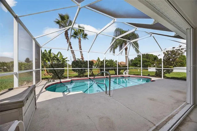 a view of a porch with chairs and front door
