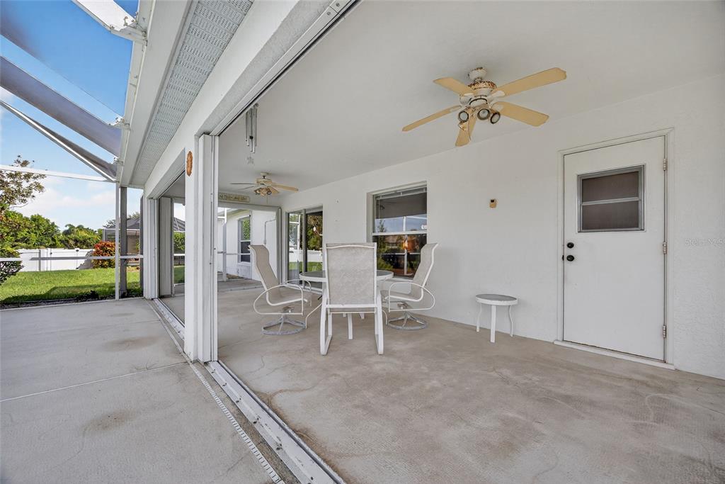 2405 Mauritania Road Punta Gorda, FL 33983 - Photo 24 of 31 a view of a porch with chairs and front door