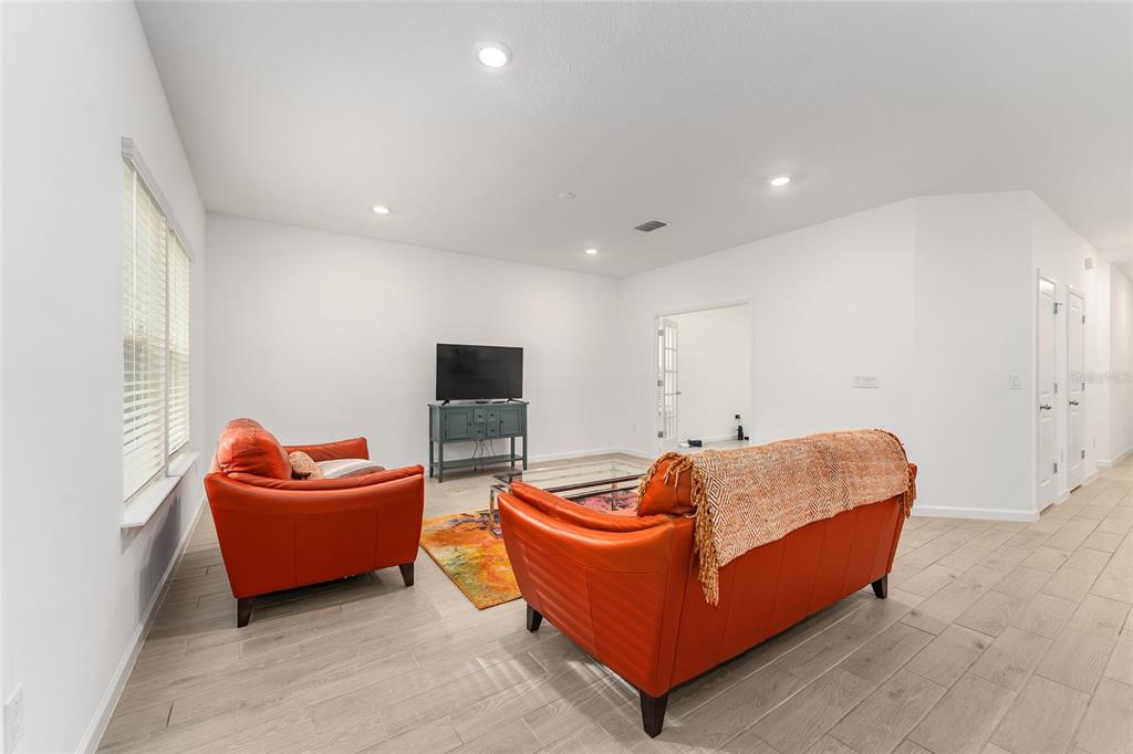 7755 Southwest 74th Loop Ocala, FL 34481 - Photo 21 of 66 a living room with furniture and a couch