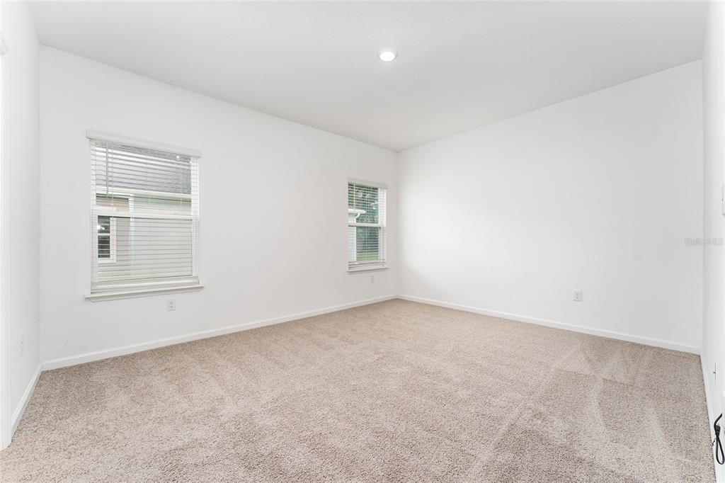 7755 Southwest 74th Loop Ocala, FL 34481 - Photo 25 of 66 an empty room with windows