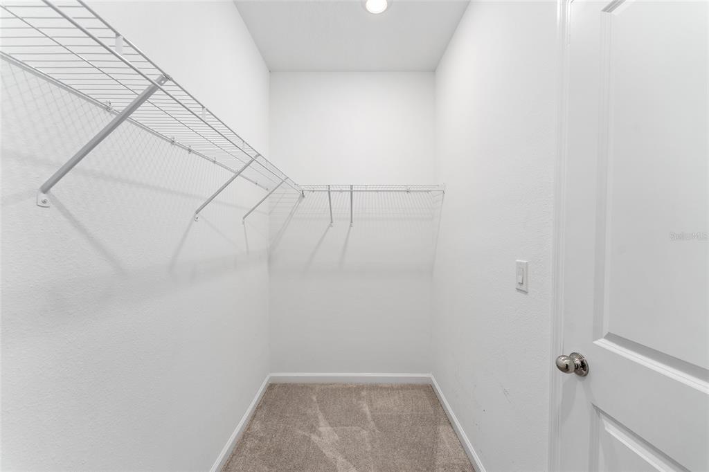 7755 Southwest 74th Loop Ocala, FL 34481 - Photo 32 of 66 a view of a room with racks on the wall