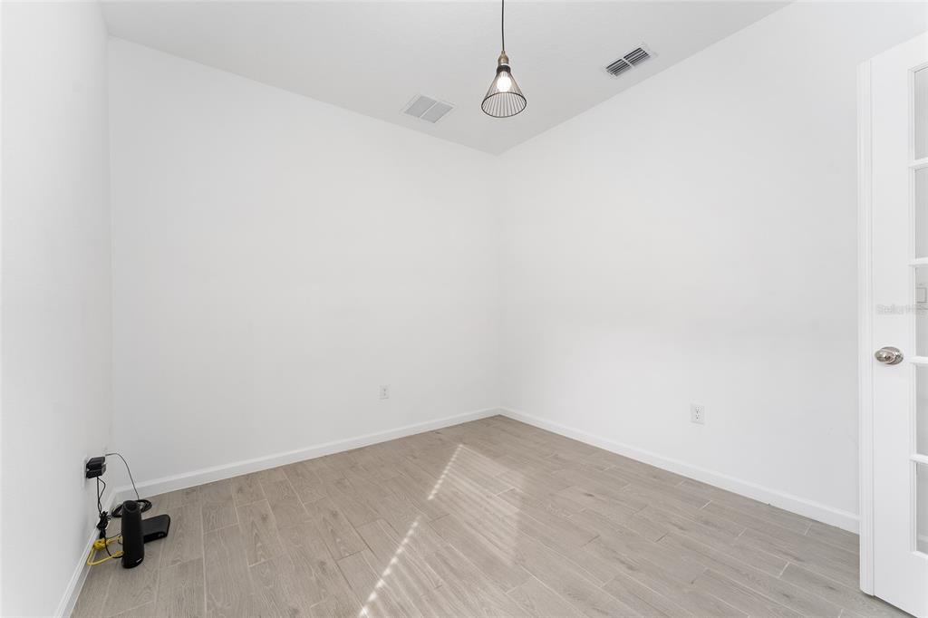 7755 Southwest 74th Loop Ocala, FL 34481 - Photo 34 of 66 a view of a room with wooden floor