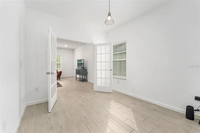 a view of an empty room with windows