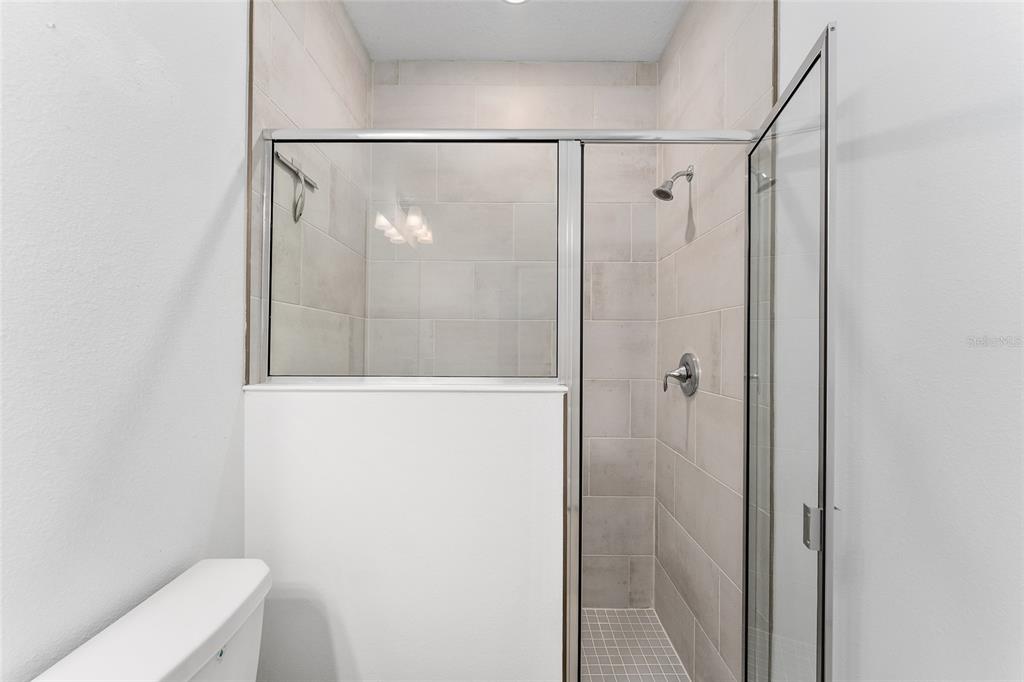 7755 Southwest 74th Loop Ocala, FL 34481 - Photo 38 of 66 a bathroom with a shower and a toilet