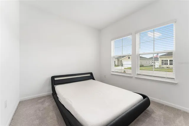 a view of a house with backyard and garden