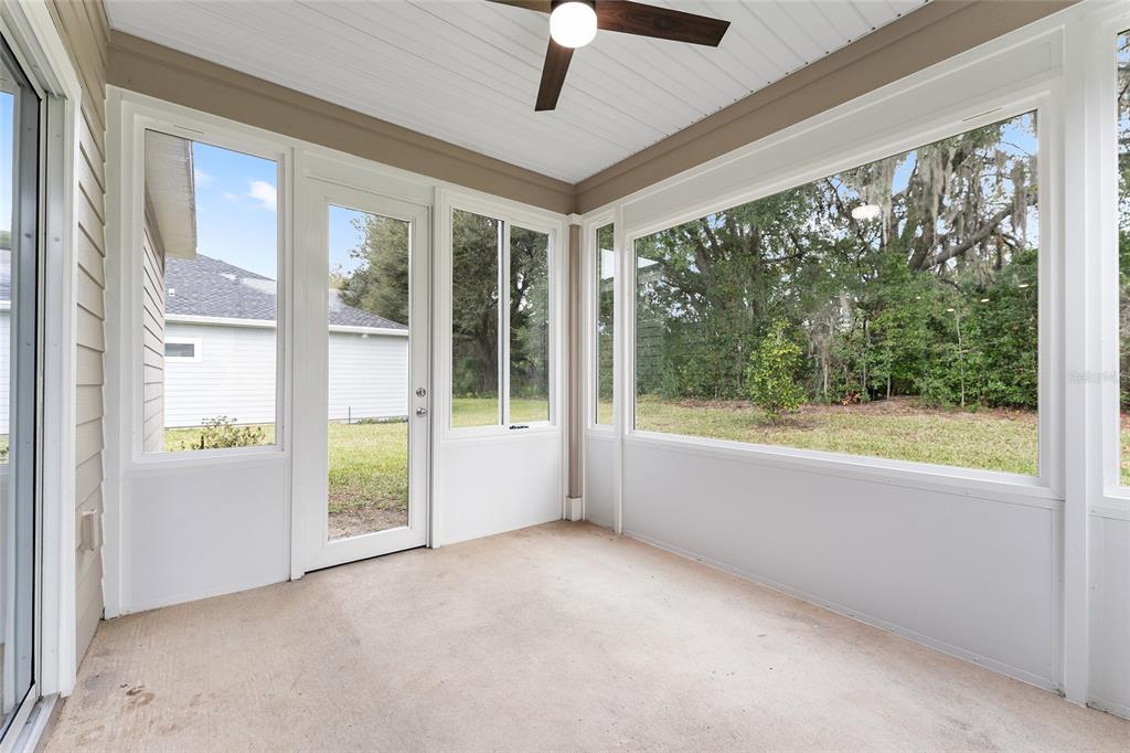 7755 Southwest 74th Loop Ocala, FL 34481 - Photo 46 of 66 a view of an empty room and window ceiling fan