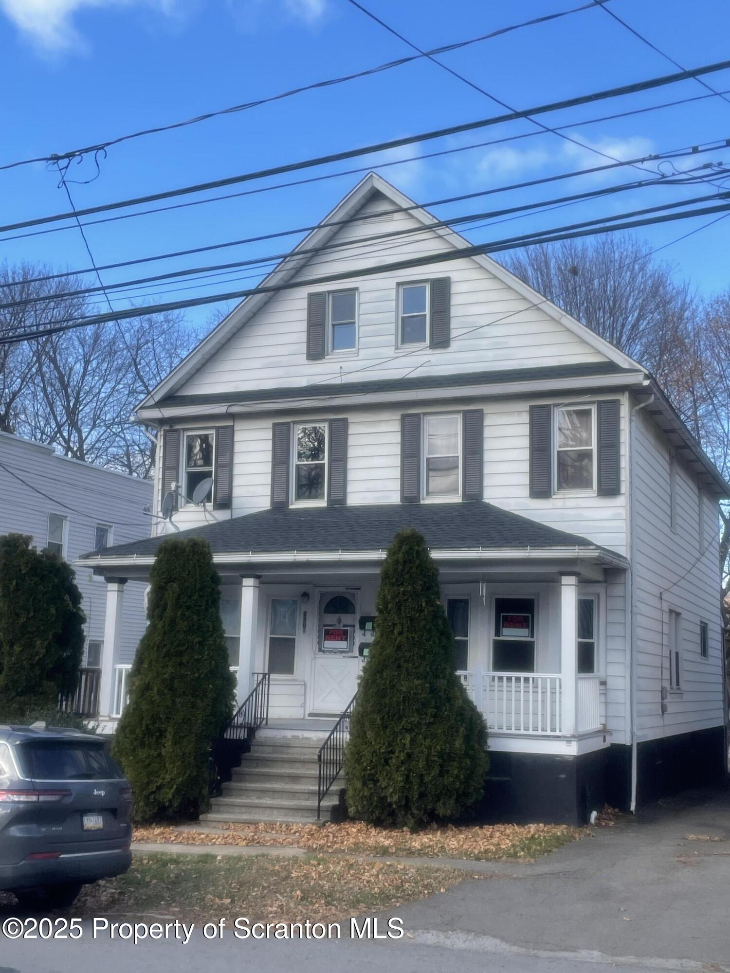 2301 Boulevard Avenue Scranton, PA 18509 - Photo 1 of 25 a front view of a house with a yard