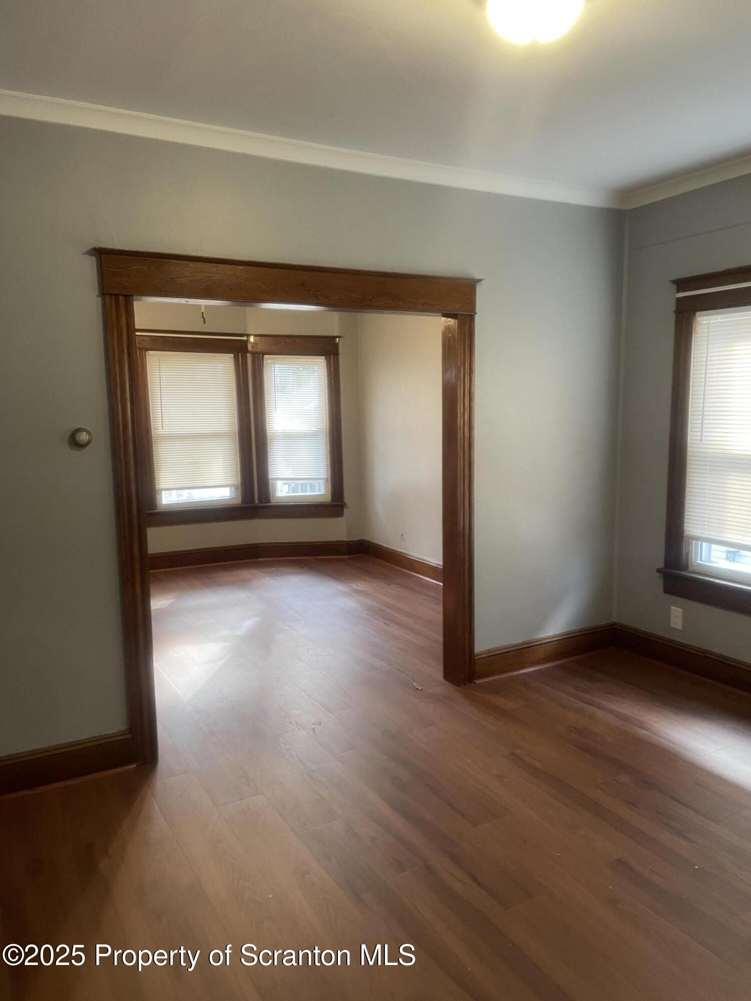 2301 Boulevard Avenue Scranton, PA 18509 - Photo 6 of 25 a view of a livingroom with wooden floor and a window