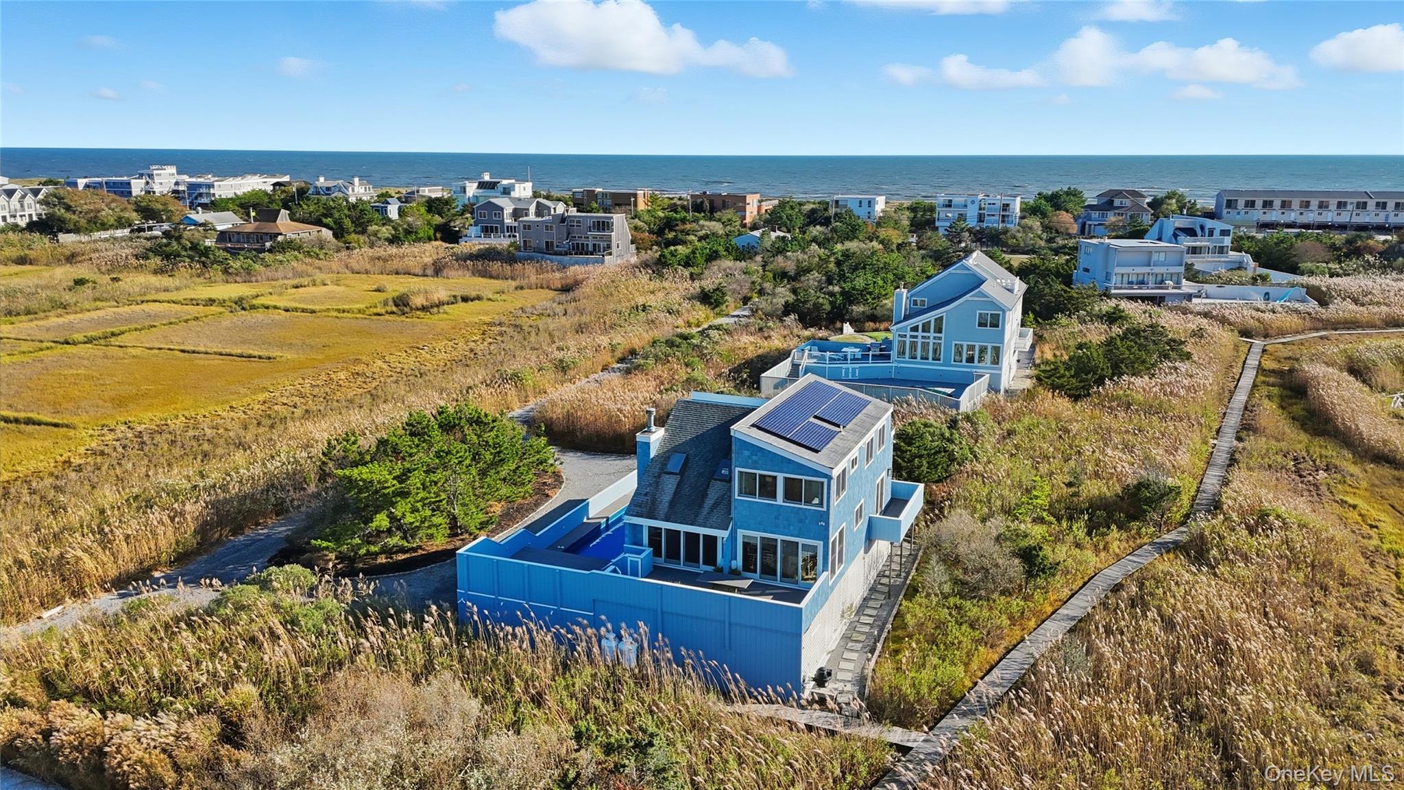 556 Dune Road Westhampton, NY 11978 - Photo 2 of 20 a view of a city with an ocean view