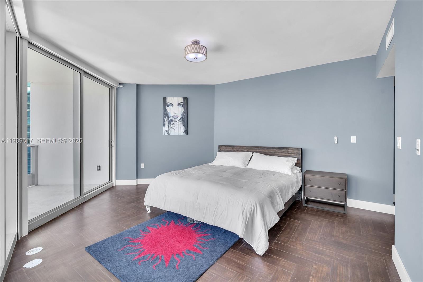 200 Biscayne Blvd Way, Unit 4202 Miami, FL 33131 - Photo 12 of 31 a spacious bedroom with a bed and a view of bathroom