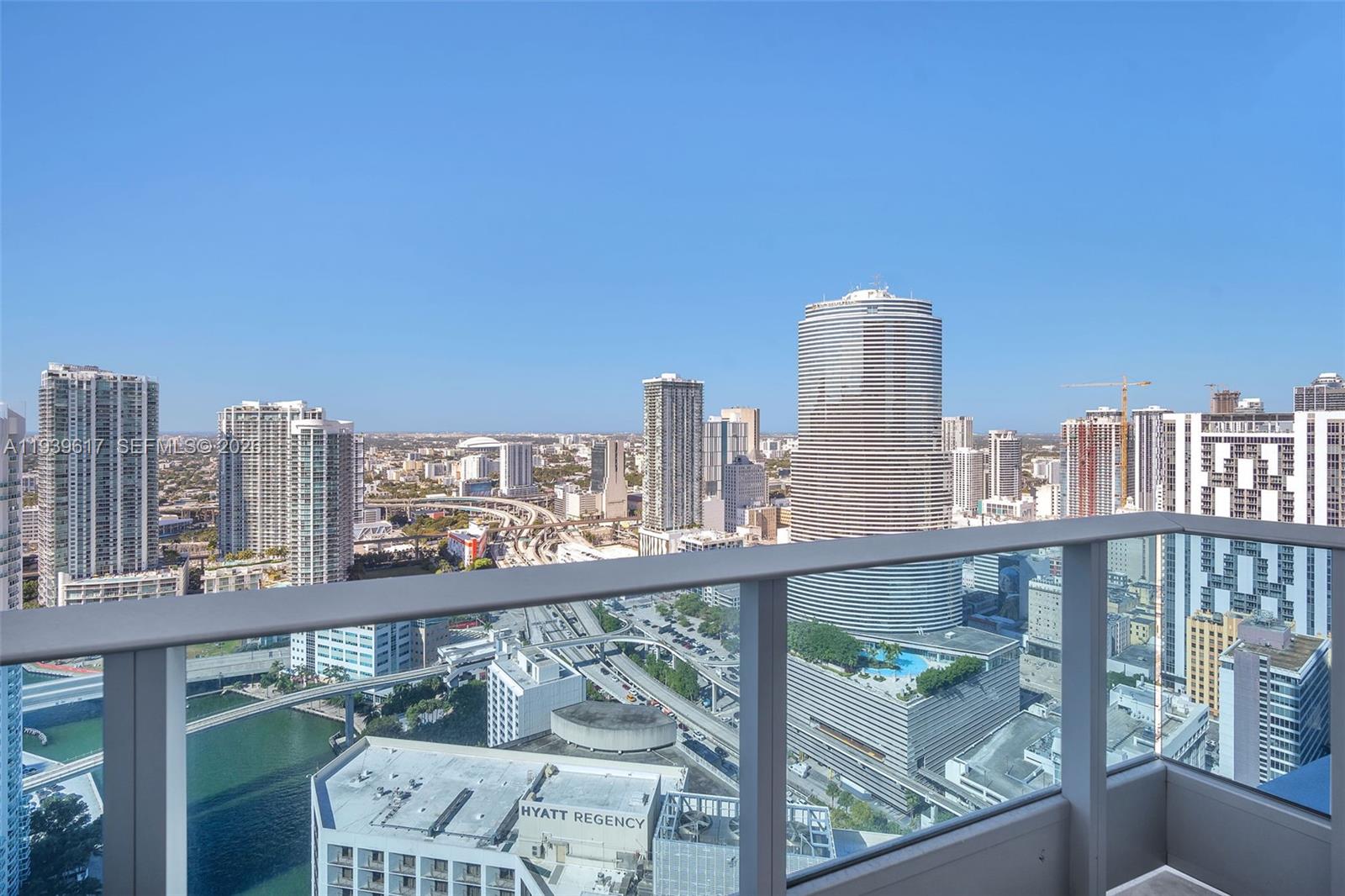 200 Biscayne Blvd Way, Unit 4202 Miami, FL 33131 - Photo 13 of 31 a view of a tall building from a balcony