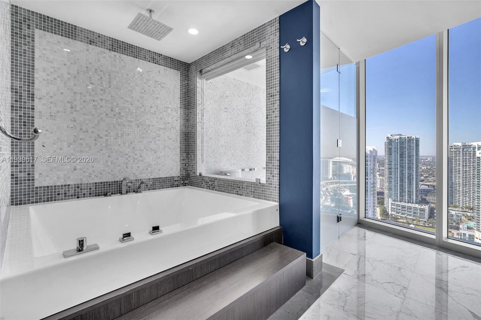 200 Biscayne Blvd Way, Unit 4202 Miami, FL 33131 - Photo 15 of 31 a bathroom with a bathtub and a shower