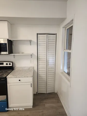 a view of a storage & utility room with washer and dryer