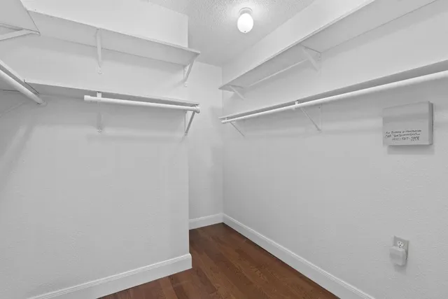 a view of an empty walk in closet