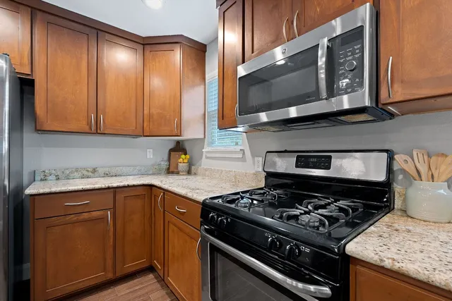 a kitchen with a stove and a microwave