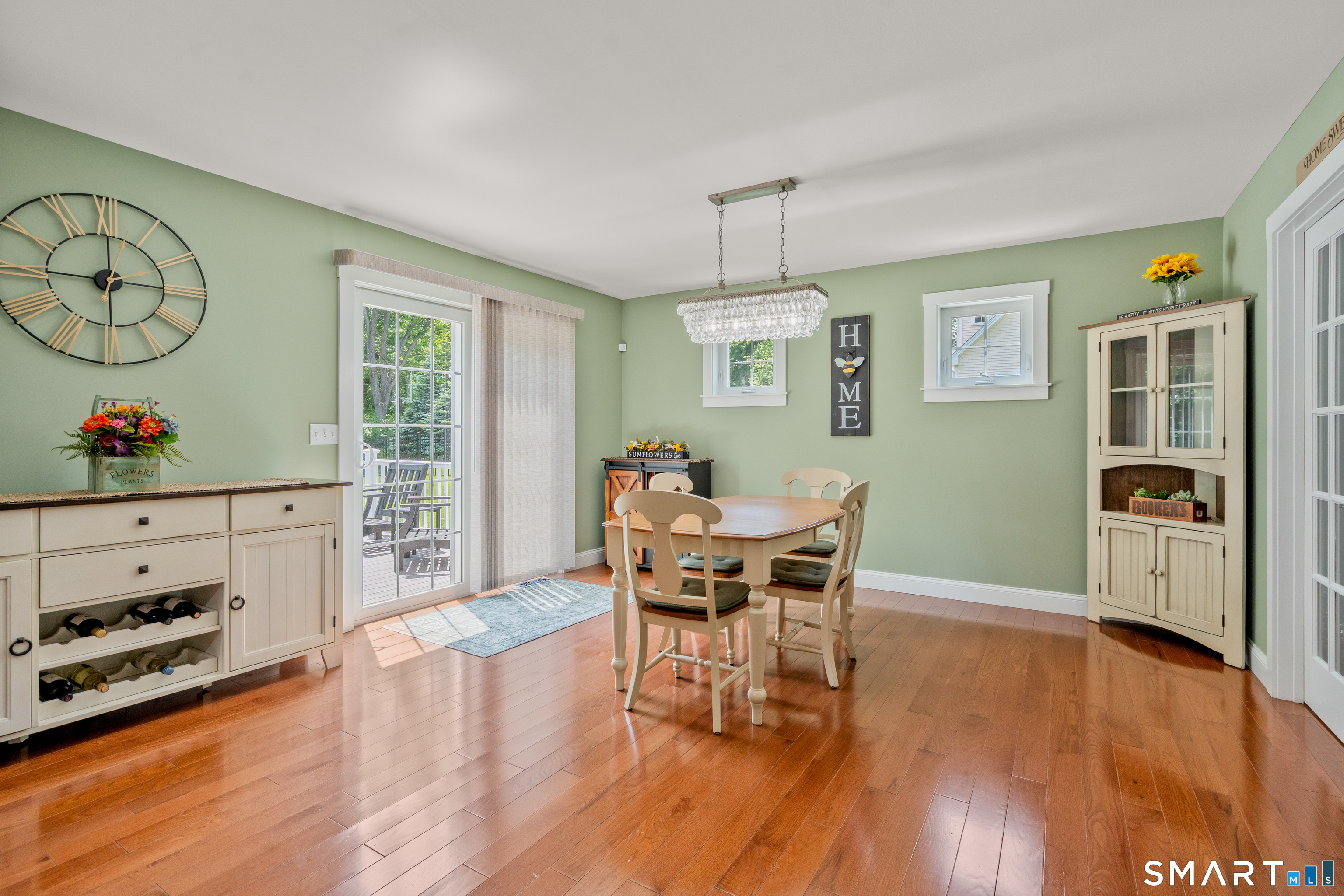 5 Limric Lane Suffield, CT 06078 - Photo 11 of 36 a view of a dining room with furniture a chandelier and wooden floor