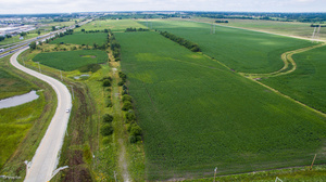 6051 West Stuenkel Road Monee, IL 60449 - Photo 2 of 7 a view of a lush green field with a lake view