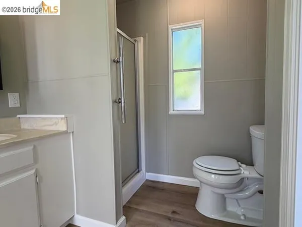 a bathroom with a toilet and a sink