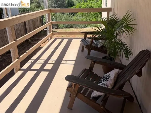 a view of balcony with furniture