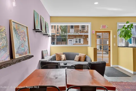 a living room with furniture and large window