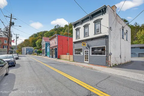 a view of a house with a street