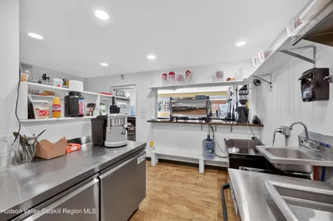 a kitchen with counter top space cabinets and appliances