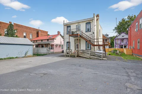 a view of a house with a street
