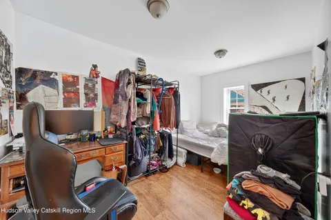 a view of a room with workspace and music instruments