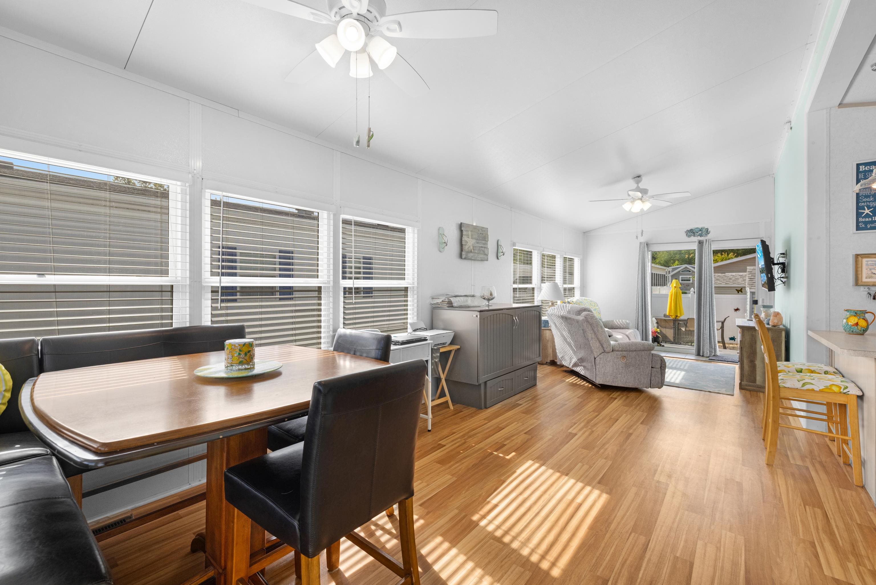 4100 Rte 9 South, Unit 49 Rio Grande, NJ 08242 - Photo 5 of 31 a dining room with wooden floor and furniture