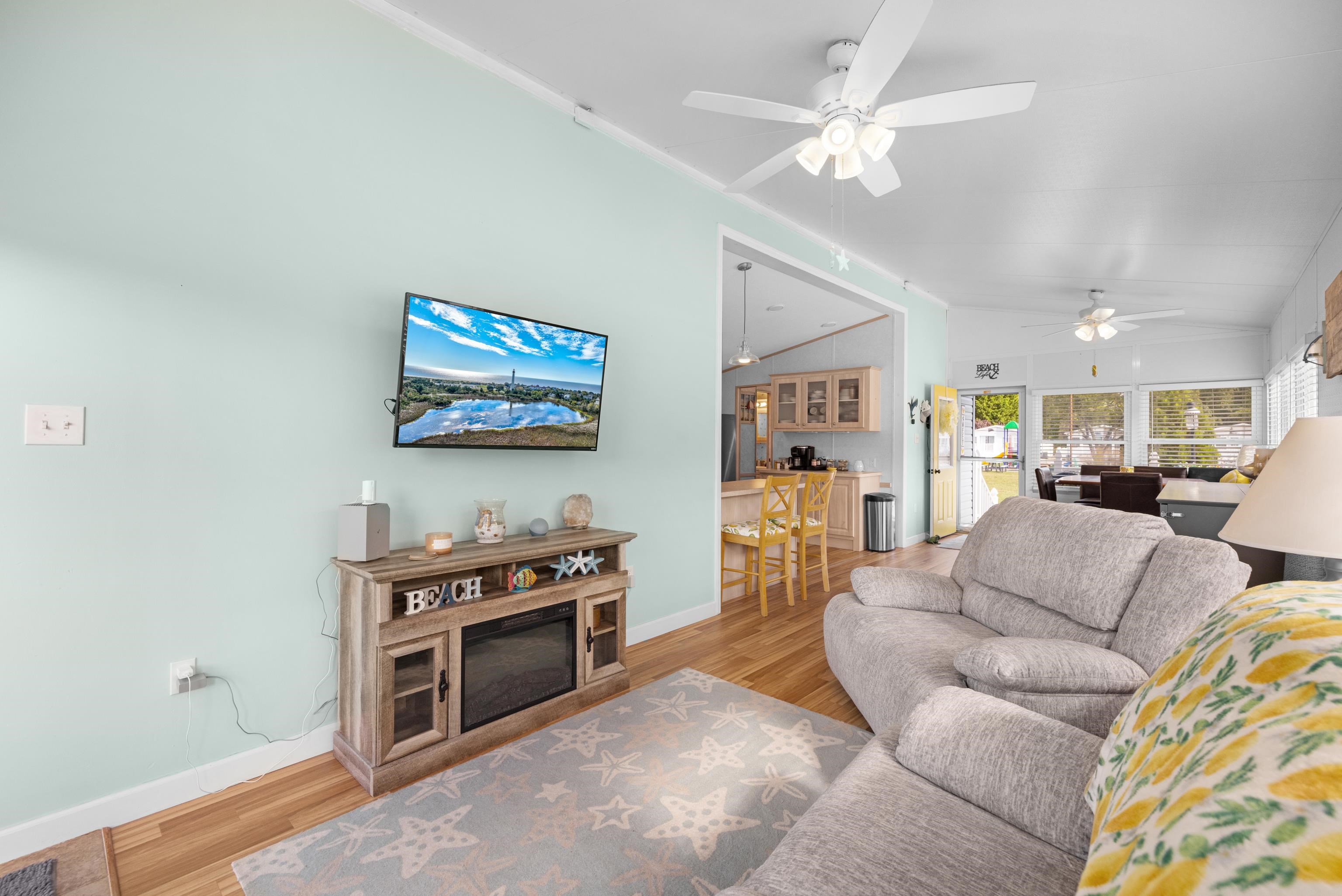 4100 Rte 9 South, Unit 49 Rio Grande, NJ 08242 - Photo 8 of 31 a living room with furniture and a chandelier