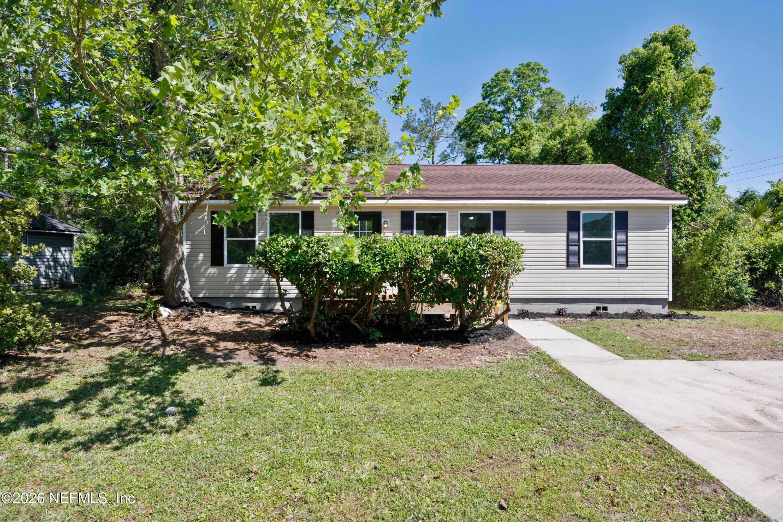 front view of a house with a yard