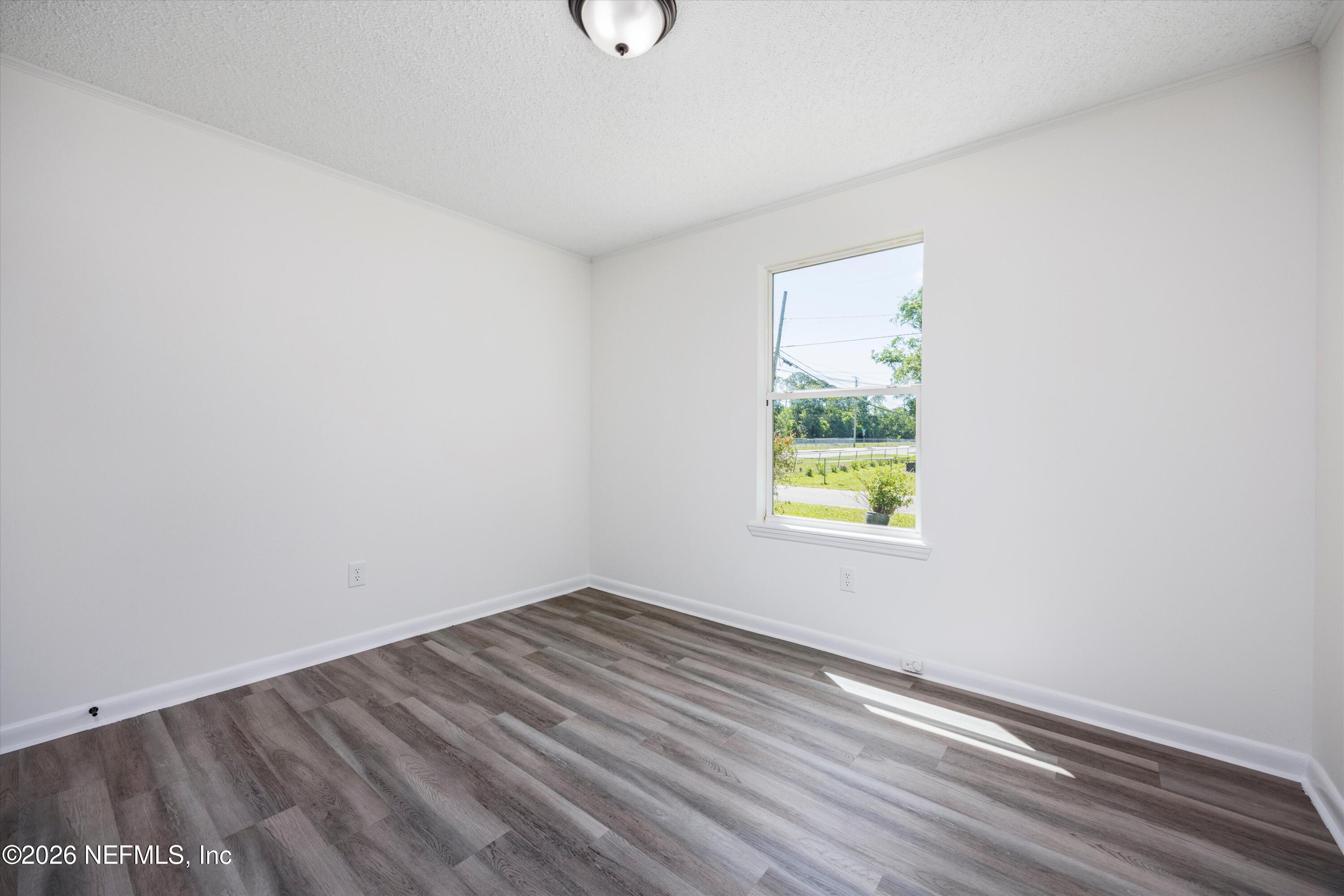 900 Helen Street St. Augustine, FL 32084 - Photo 19 of 31 wooden floor in an empty room