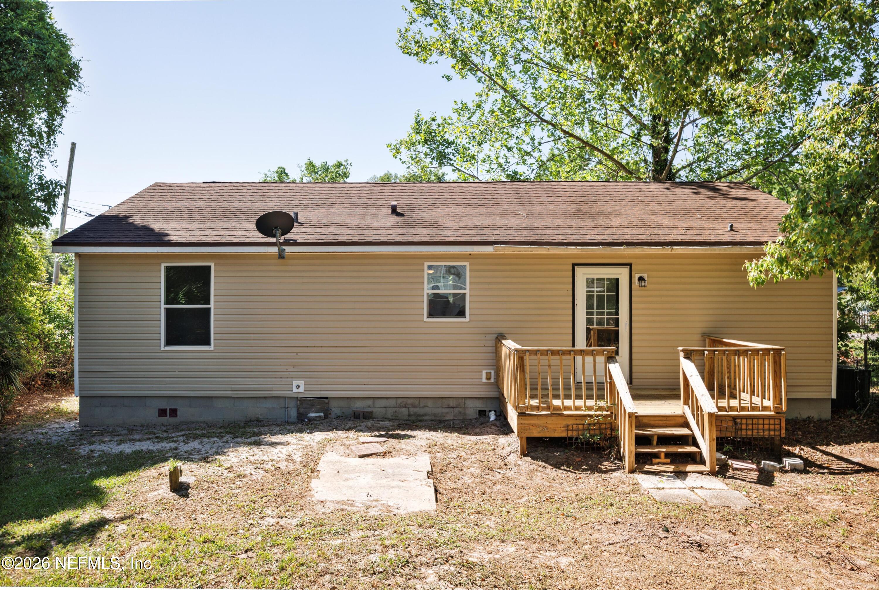900 Helen Street St. Augustine, FL 32084 - Photo 25 of 31 a view of backyard with a chair and wooden fence