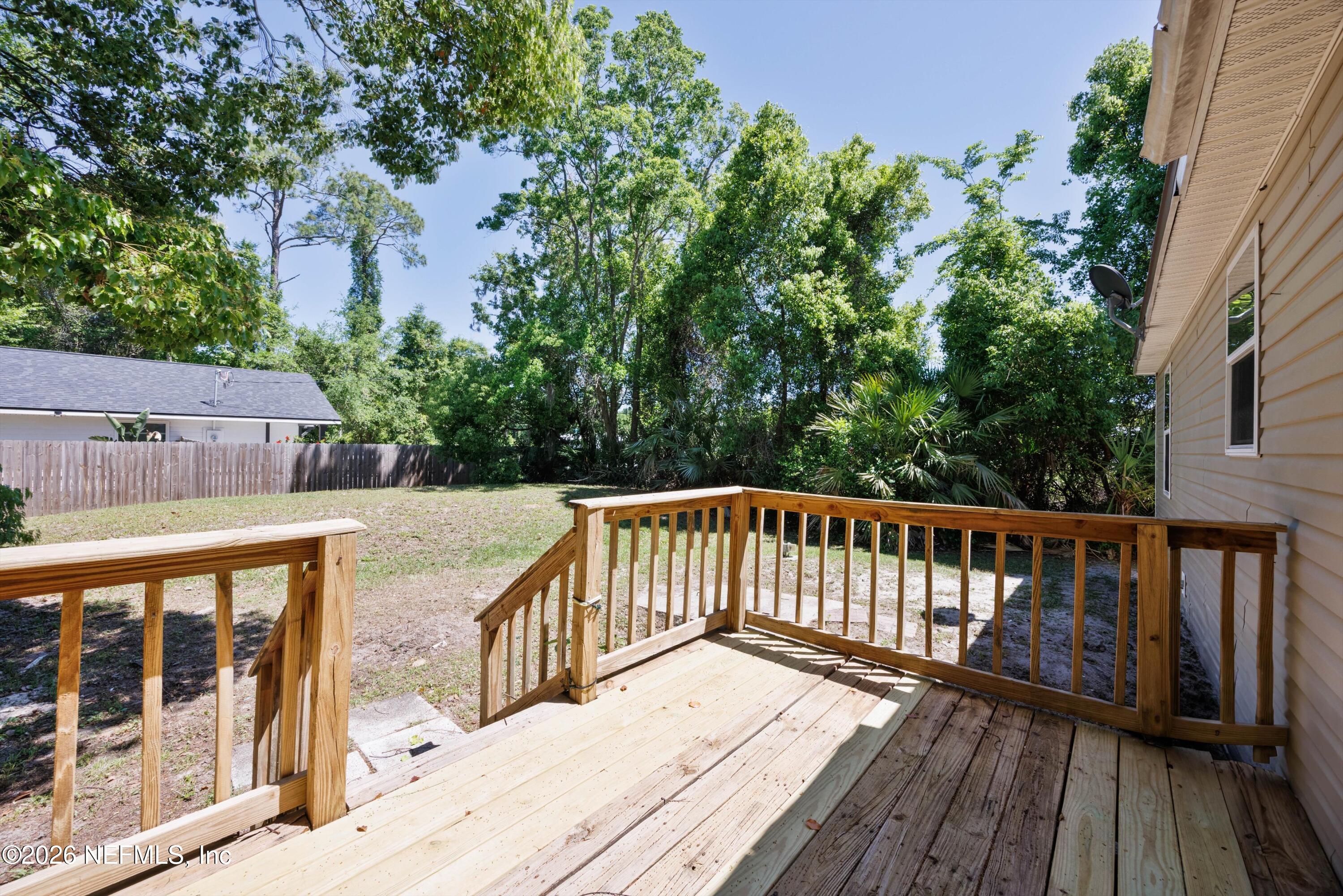 900 Helen Street St. Augustine, FL 32084 - Photo 29 of 31 a view of balcony with wooden floor and fence