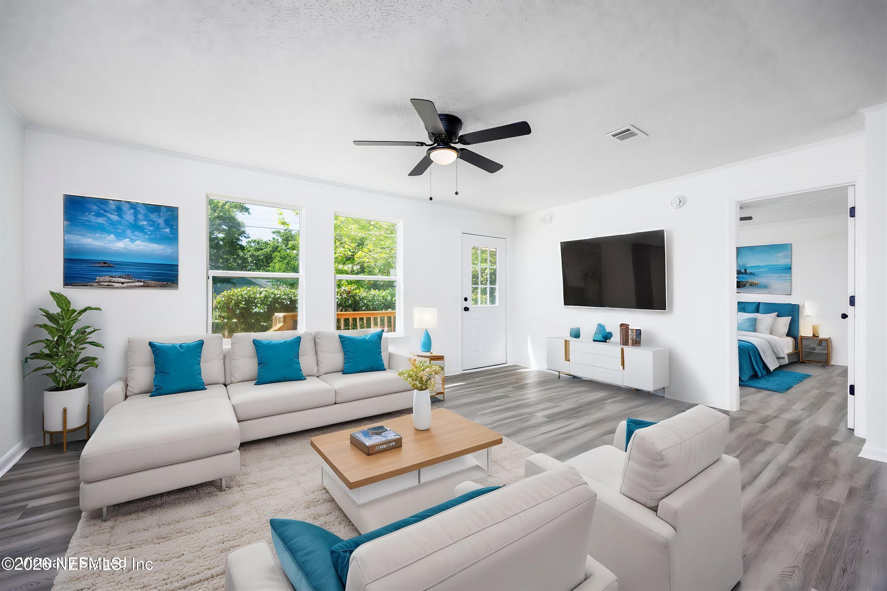 900 Helen Street St. Augustine, FL 32084 - Photo 5 of 31 a living room with furniture and a flat screen tv