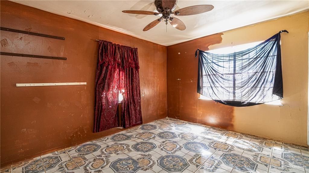 610 West Pike Boulevard Weslaco, TX 78596 - Photo 13 of 15 Spare room featuring a ceiling fan