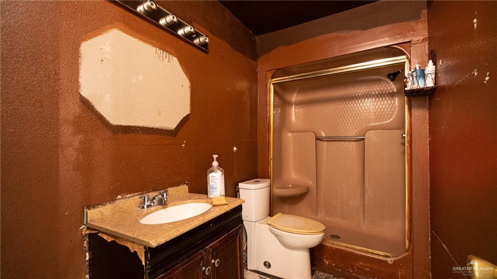 610 West Pike Boulevard Weslaco, TX 78596 - Photo 15 of 15 Full bathroom with a shower stall and vanity