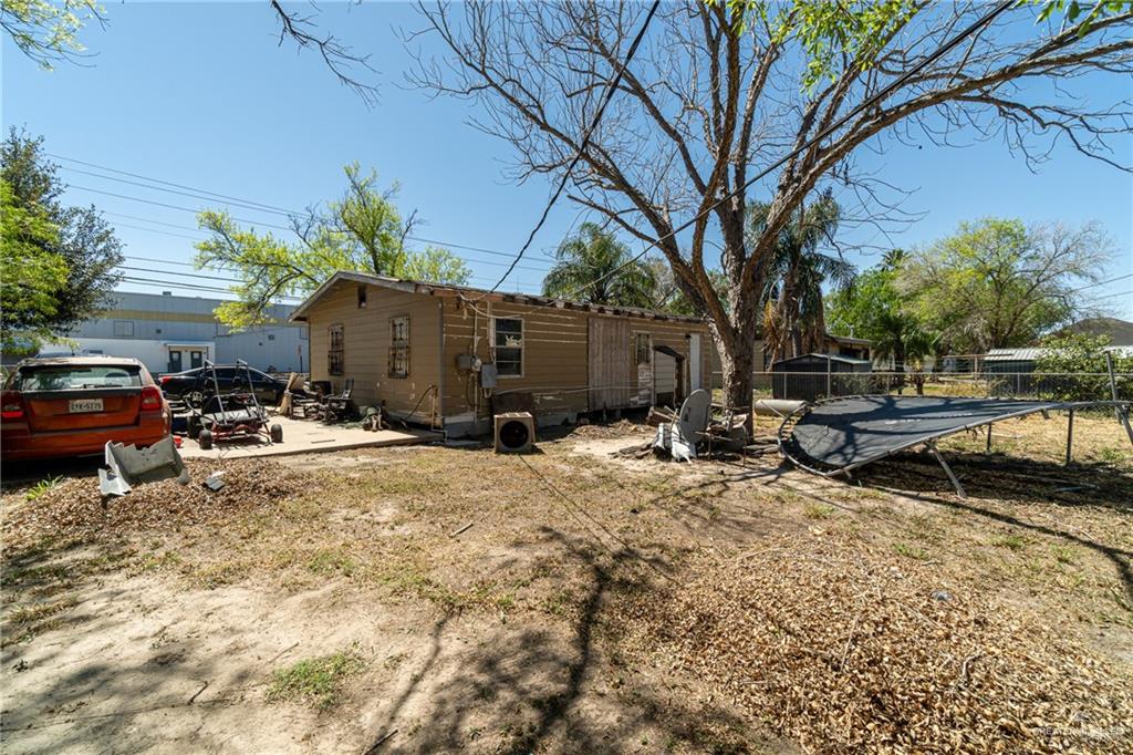 610 West Pike Boulevard Weslaco, TX 78596 - Photo 7 of 15 Back of property with a patio area