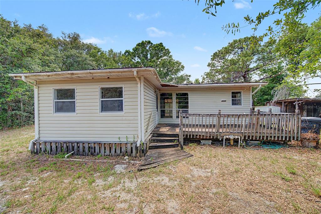 Cutrone Road Winter Haven, FL 33880 - Photo 12 of 50 a view of a house with backyard and deck